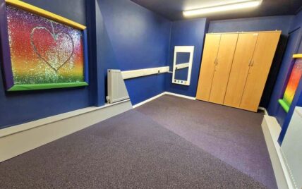 blue walls purple carpet sensory room cleaning